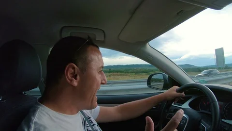 Men dancing and singing while driving on a highway, having fun and smiling Stock Footage 96342444