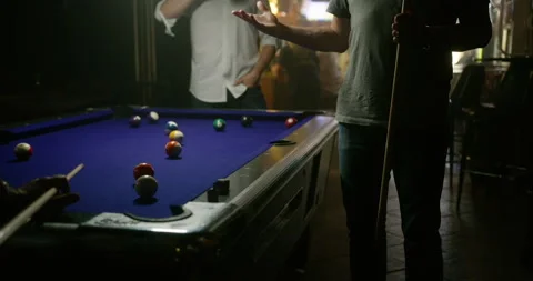 Men in Dark Bar Playing Pool Stock Footage 134203733