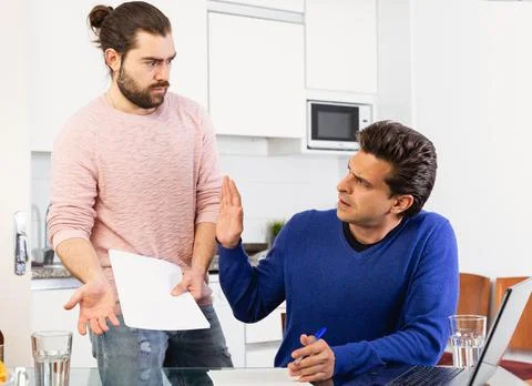 Men discuss the terms of a contract Stock Photos