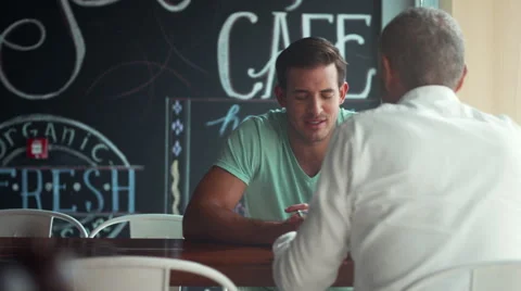 Men discussing at cafe. Stock Footage 64093956