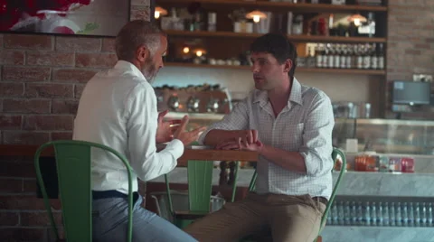 Men discussing at cafe. Stock Footage 64093987