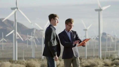 The men discussing the project presented in the tablet Stock Footage 77441066