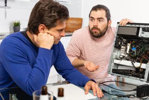 Men do not know how to repair a computer Stock Photos