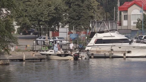 Men Docking Boat Stock Footage 93285760