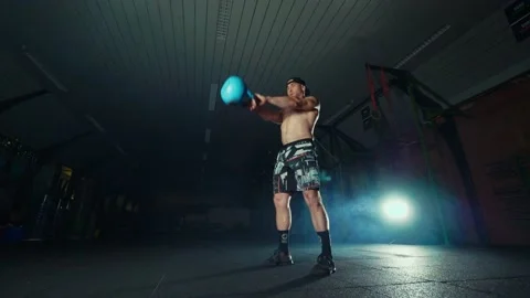 Men doing crossfitt swing with kettlebell exercise Stock Footage 131029774