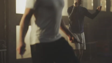 Men doing jumping rope exercise Stock Footage 236190923