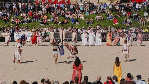 Men dressed as Roman gladiators simulate fight at Circus Maximus Stock Footage 97413118