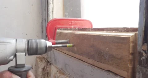 Men drilling in wood plank to insert and drive wooden dowel. work with Drilling Stock Footage 152831215