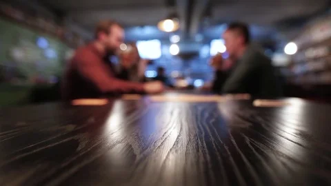 Men drink beer at a bar, blurred background Stock-Footage 75641863