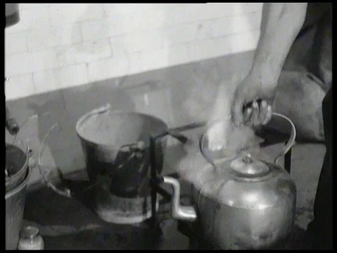 Men drink tea after their shift in London Underground maintenance UK 1958 Stock Footage 136677832