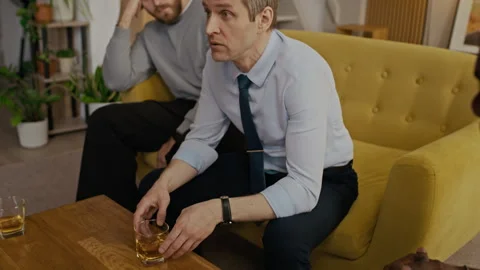 Men Drinking Bourbon and Sharing Problems with Each Other Stock Footage 335144041