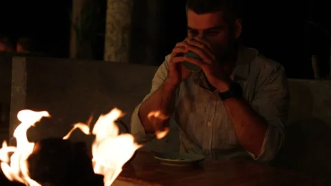 Men drinking tea near bonfire. Video stock 274476103