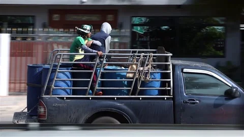 Men drive with cargo in the back of a pickup truck Video stock 276163145