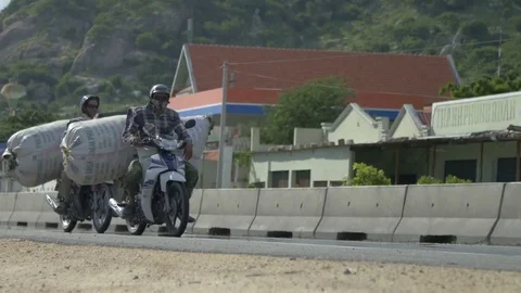 Men driven load on a motorcycle Stock Footage 72429831