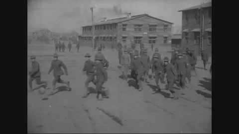 Men enjoy their playtime by engaging in various outdoor activities - 1917-1918 Vídeos de archivo 83702480
