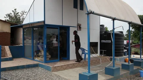 MEN ENTER PAKRO WATER HEALTH CENTER Stock Footage 59735049