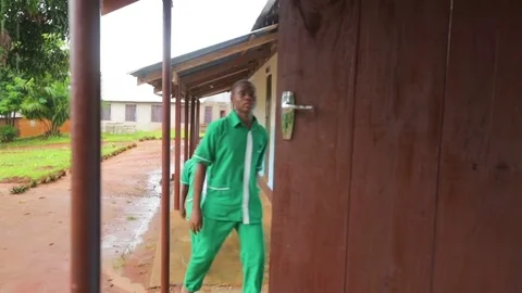 Men entering a house through an already opened door Stock Footage 77444003