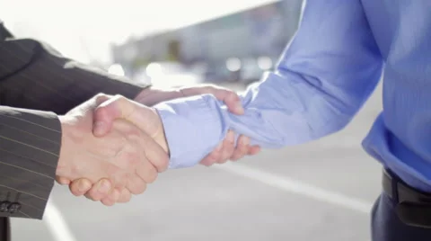 Men exchange keys and shake hands Stock Footage 49886873