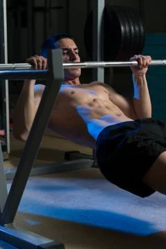 Men exercising back on horizontal barbell pull up Stock Photos