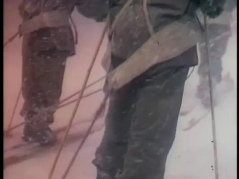 Men on expedition trudging through snow storm in Antarctica Видео 260250482