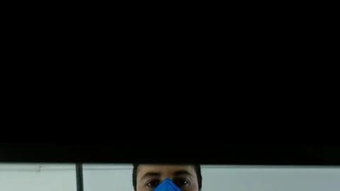 Men with a face mask open a drawer. Recording from within the file Stock Footage 129392225