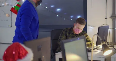 Men in face masks working on computer in open space office Stock-Footage 144267877