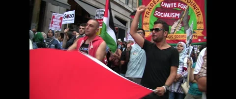 Men with Flag Huge Crowd Marching for Gaza on August 9 2014 London UK Stock Footage 144283841