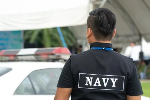 Men in the form of Thai Navy security personnel stand ready 写真素材