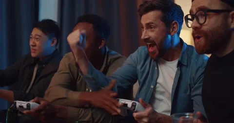 Men friends having fun playing video games and competing Video stock 219418768