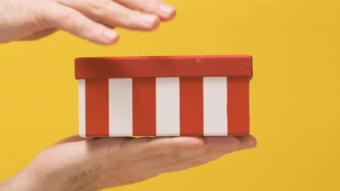Men give red box with surprise present and opens the lid Video stock 172491373