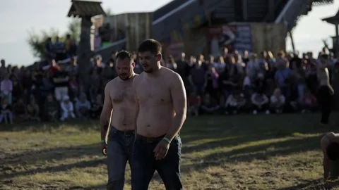 Men go around the field Stock Footage 82366409
