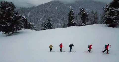 Men go skitour in deep snow forest Stock Footage 85098144