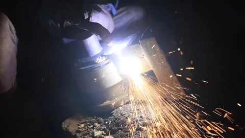 Men grinding a big casting part in factory. Industrial safety first concept. Stock Footage 296808458