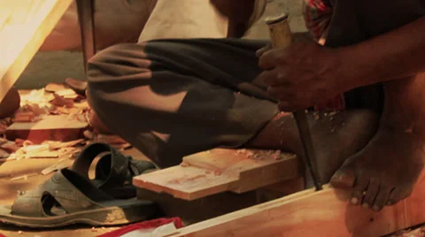 Men hammer doing carpentry in a village in Bengal, India. Stock Footage 39790280