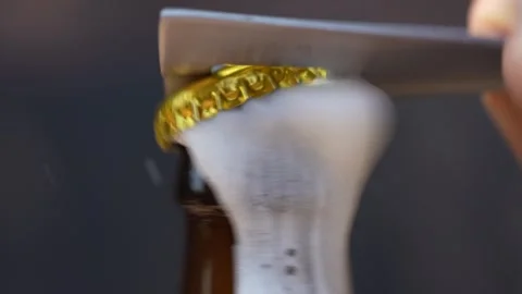 Men hand open bottle of beer. Beer foam coming out of beer bottle, slow motion Stock Footage 313473876