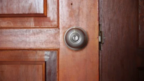 Men hand opens and closes the door knobs Stock Footage 78504243