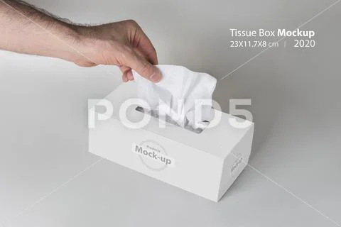 Men hand pulling a tissue from white tissue box on gray background  mock-up s PSD Template