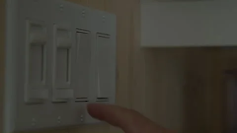 Men hand turning off light switch 動画素材 258083645