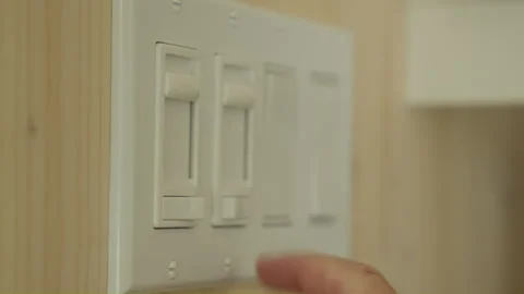 Men hand turning on light switch 스톡 동영상 258083768