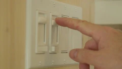 Men hand turning on light switch Vídeo Stock 258084827