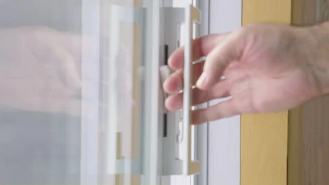 Men hand unlocked and opened a sliding patio door Stock Footage 258083147