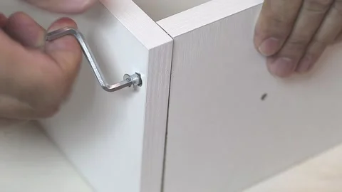 Men hands fastened two white crossbars Stock-Footage 221982529