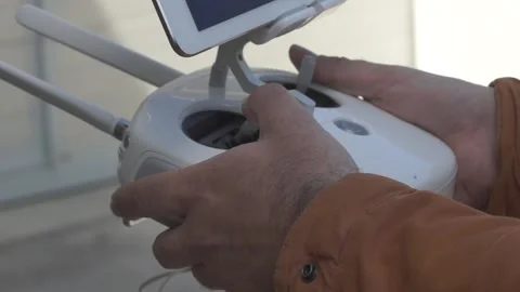 Men hands hold a plastic quadrocopter control panel in their hands Stock Footage 91829270