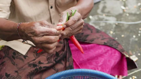 Men hands string red chili. Stock Footage 275142523