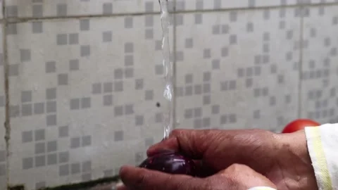 Men hands washing vegetables under tap Stock Footage 154161880
