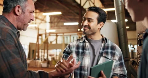 Men, handshake and carpenter team in warehouse with support, tech or happy for Stock Footage 338397621