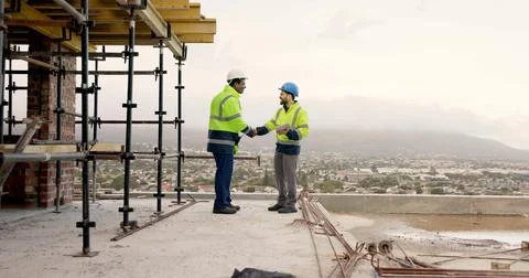 Men, handshake and tablet on construction site for agreement, development d.. Stock Photos