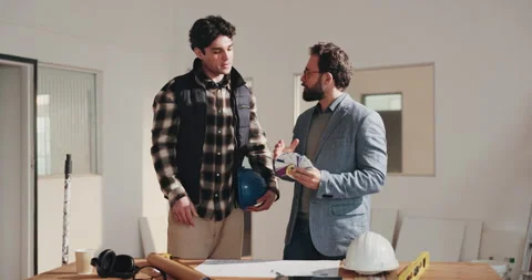 Men, handshake and talking with interior designer in house, deal or planning for Stock Footage 341551866