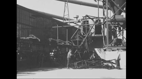 Men hang chassis on the production line of automobile factory - 1939 Stock Footage 101983437