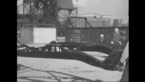 Men hang chassis on the production line of automobile factory - 1939 Stock Footage 101983458